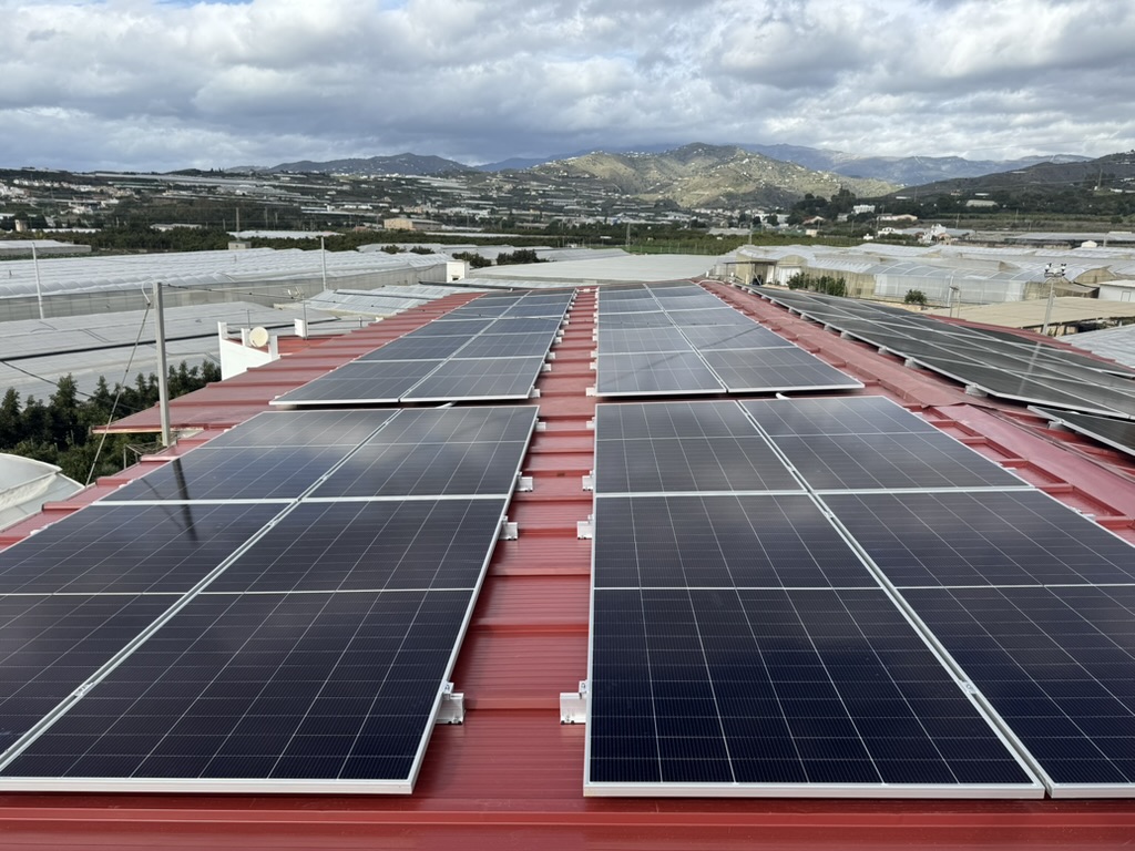 Industrial solar installation on a warehouse next to greenhouses, Axarquía